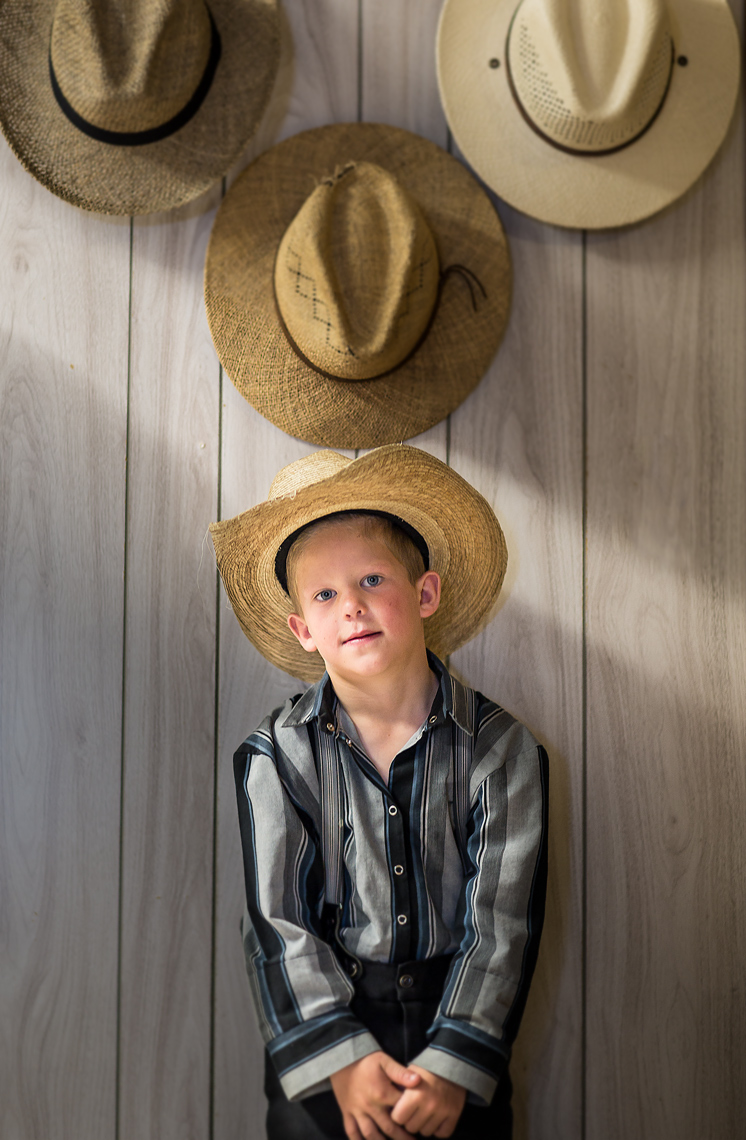Hutterite-Boy-and-Hats.jpg